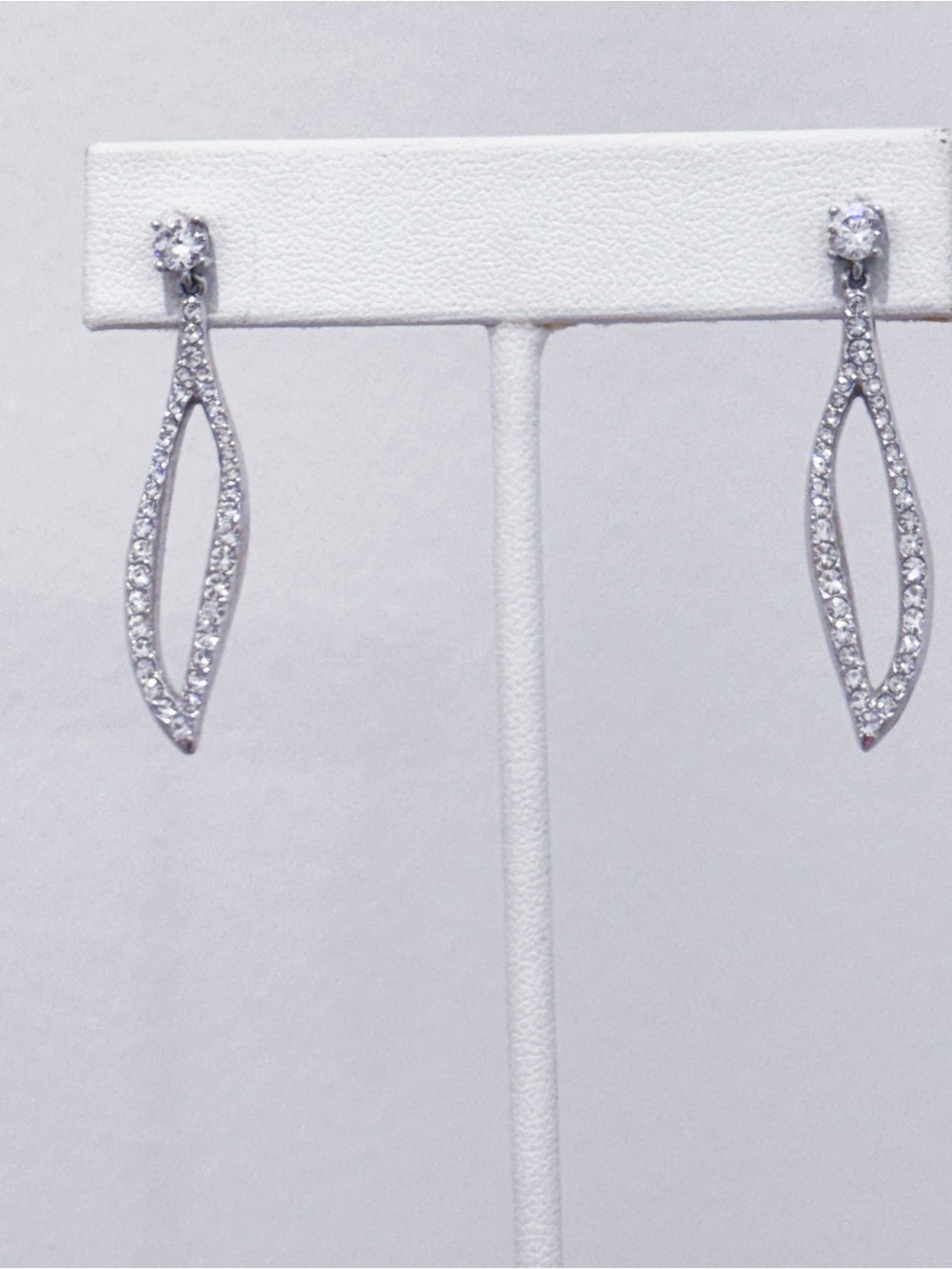 Nadri silver tone micro pave cz long swirl dangle earrings